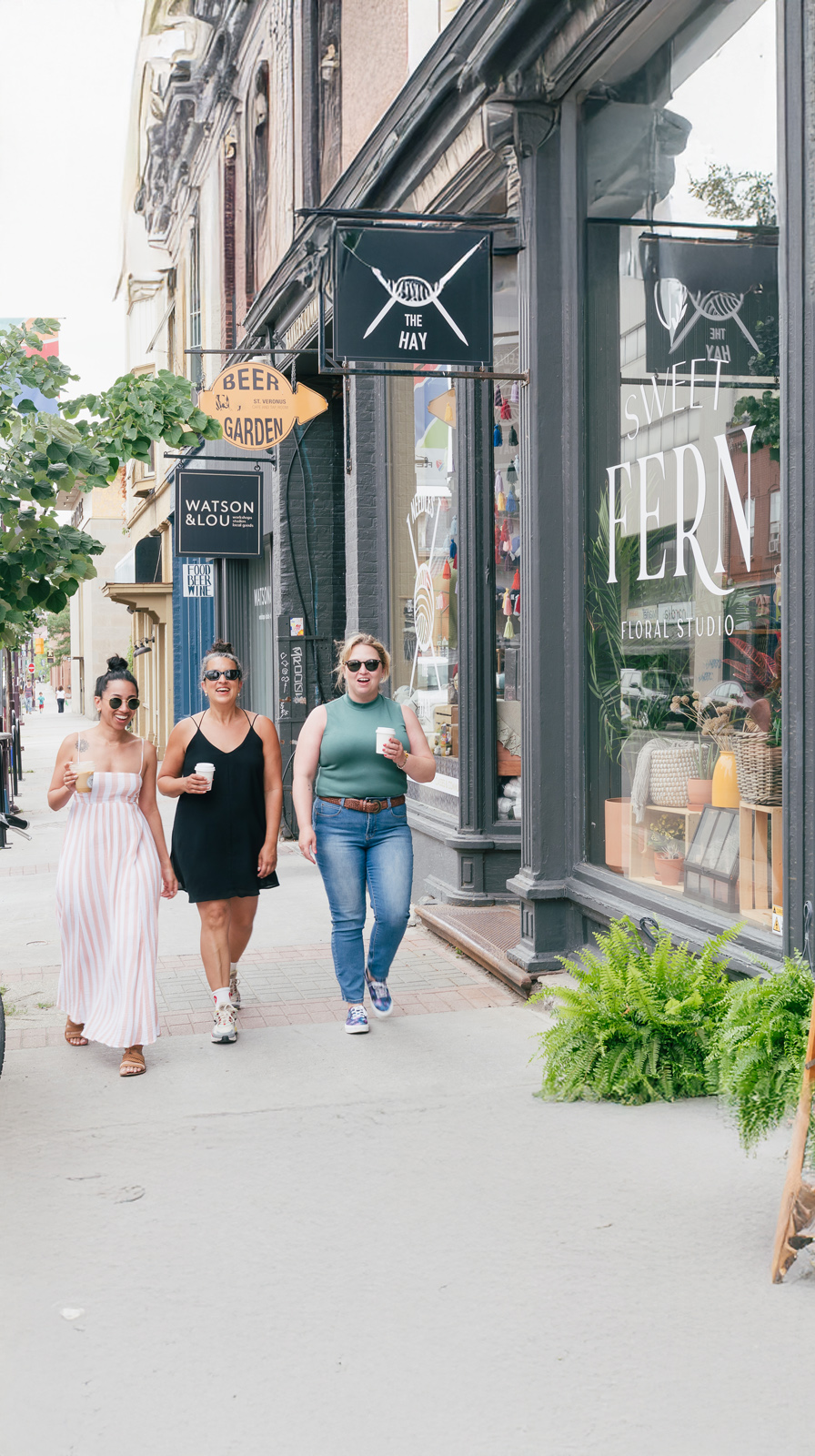 People walking on street with stores