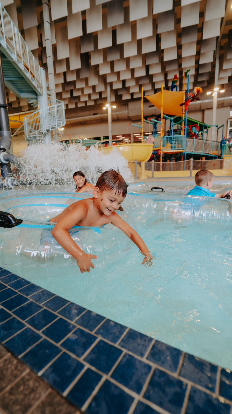 Child swimming in an indoor pool