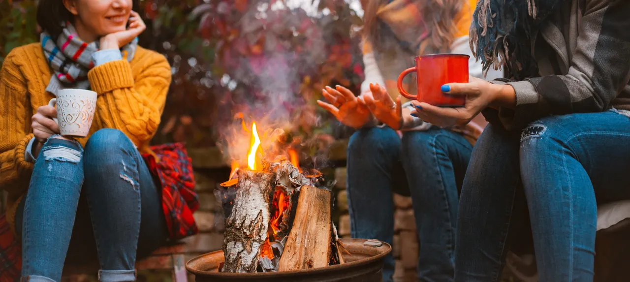 Sunset-Shores-Resort-women-around-campfire